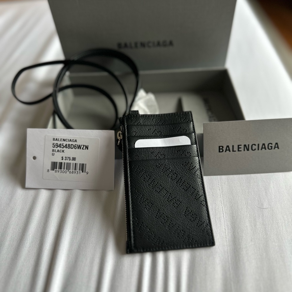 Brand new in box Balenciaga black wristlet card holder.